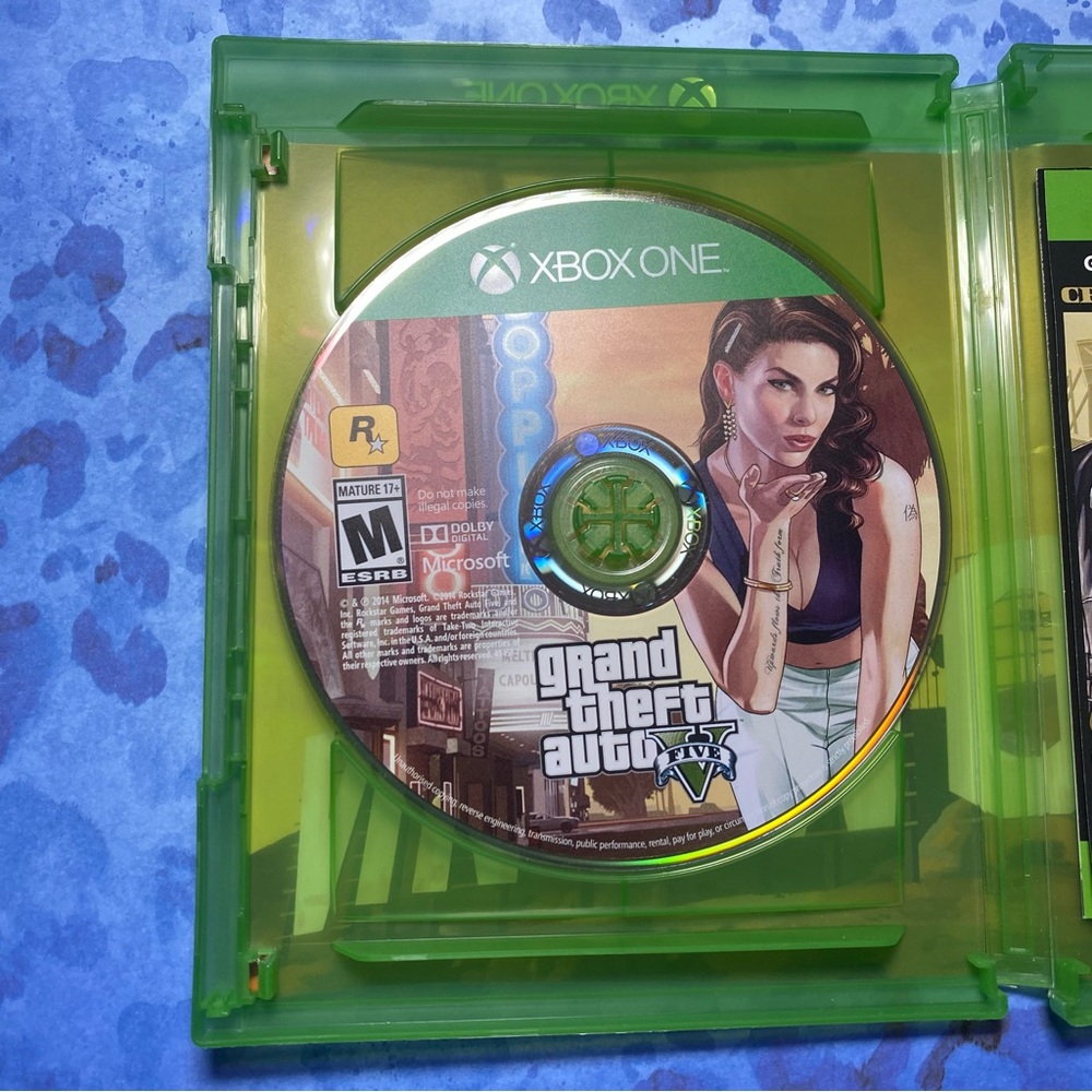 One Grand Theft Auto V Game Disc - Green Case